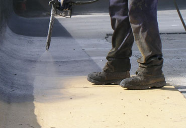 Coating systems over Athens spray foam roof systems